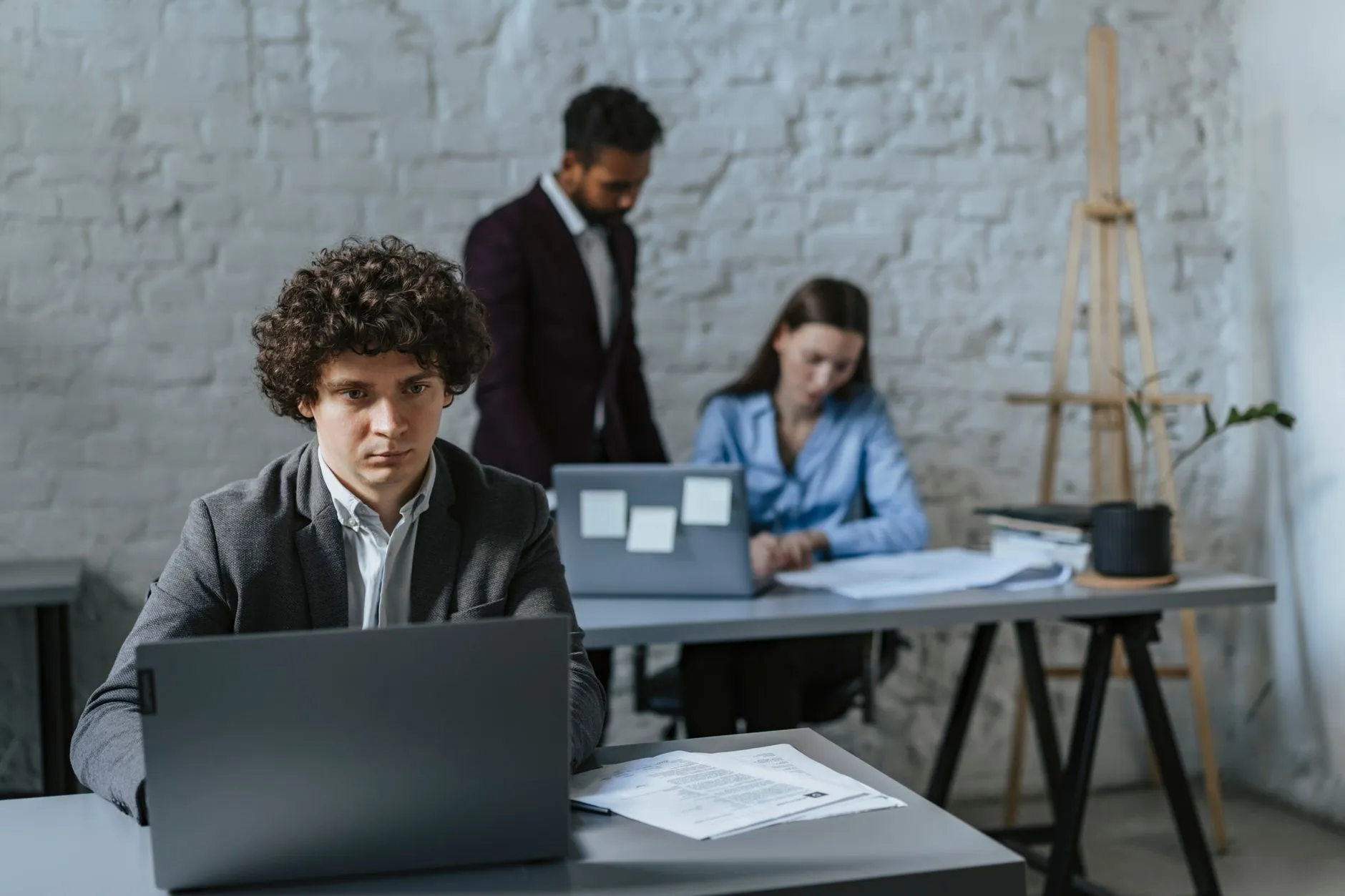 Entrepreneur at a desk using a laptop for business planning. Ideal for tech and startup themes.